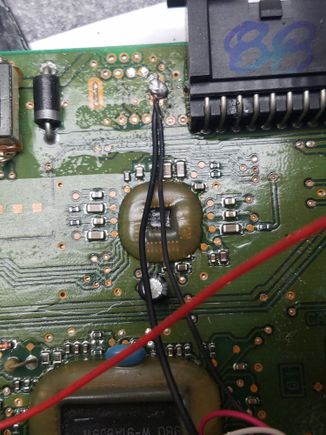 Ground connection.  This one was tough to solder in.  Took scraping off the coating and getting down to bare copper and solder, plus lots of heat to get the factory solder to bond.