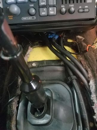 Speaker wires tucked into the console area.  I used an adapter between the factory radio and car harness so I wouldn't need to splice directly into those wires.