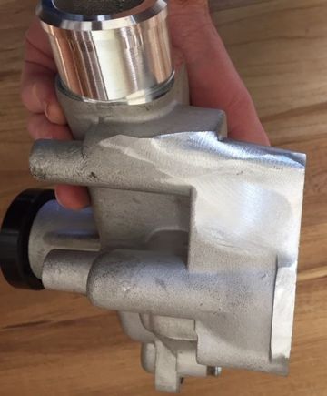 Some of the material removal that was required to clear the air conditioner and air pump bracket.