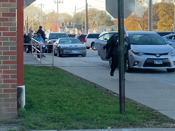 My boy cheesing behind the stop sign lol