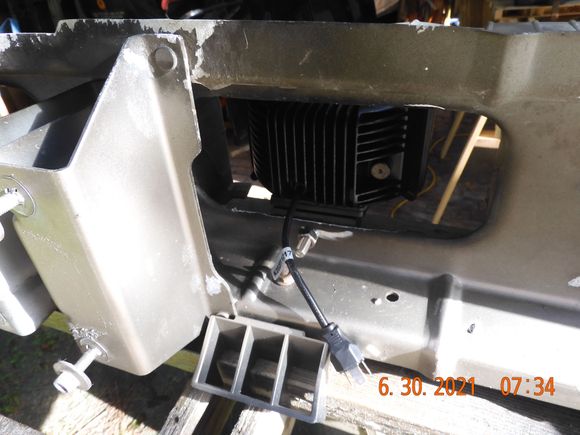 Drilled a mounting hole to center the light in the opening of the louver panel (each side).
