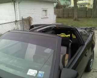 She needs a new headliner badly. As you can see in this shot, the previous owner &quot;fixed it&quot; with some duct tape. 

The rubber around the tops seems like it's in good condition, so I don't think this is water damage; just 23 years of wear and tear.