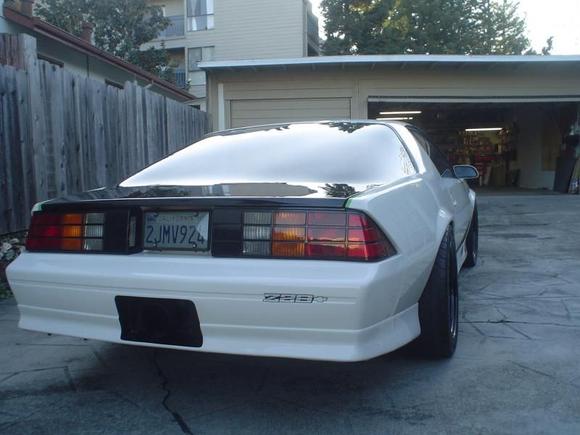068 Custom White 87 Camaro. THE 335'S JUST TUCK IN, I HAD TO ROLE UP THE FENDERS , VERY CLOSE !!!!!