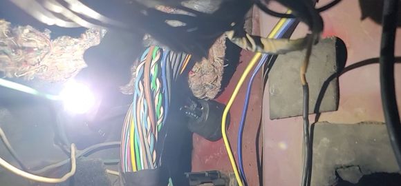 Vacline heading into fender area using the existing antenna cable grommet.