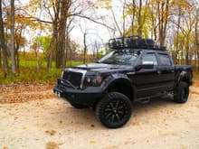 This Ford has been seriously beefed up with bumpers, fender flares, a roof rack, 35-inch tires, and enough lights to brighten any off-road path it forges.