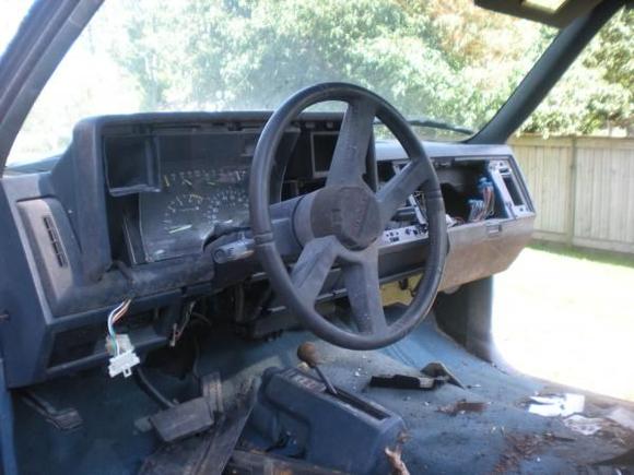the interior with the das and guages still hooked up with all trim pieces and extra stuff i took out