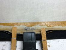 about the middle of the cover 1in wear through spot reinforced with repair cloth