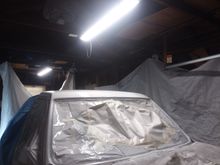 My portable garage made a nice makshift painting booth complete with a fan I put up near the roof with a vent.