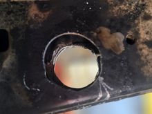 Hole saw with a right angle drill was used for the inside frame rail on passenger side. All the holes were done with the jigs tacked in place. I used 1.75" hole saw just cause it was the closest one i had size wise. Im not home to measure at moment, i believe 1.875" is the correct one. All 4 holes i went over with right angle die grinder to clean up the torch slag and just fine tune them to match the jigs.