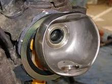 The part I was talking about can be seen right behind the inner axle shaft seal in this picture. It is a thin metal bushing that is a part of the axle housing. I reassembled it without the passenger side one in because it got bent and would not stay pressed in. Any help would be appreciated!