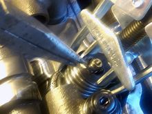 VERY CAREFULLY pulling out the keepers while the cylinders have compression.....you don't want to accidentally drop a hardened keeper into the motor!