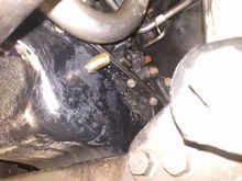 oil drain hose barb installed into pan