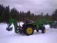 The John Deere 4700

with a back howe on it