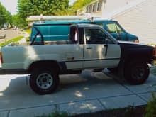86 4runner with rear fender rust, gas tank rust, new front fenders with faded white paint. 95K miles
