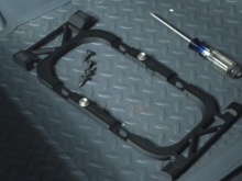 After multiple prototypes, this is the final form of the adapter. It uses two bolts to mount together and uses the OEM screws to mount to the Shifter plate. 