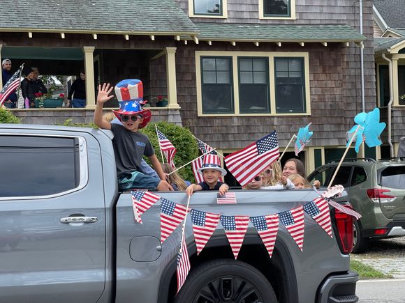 One of the best days in a kid’s life, riding in the bed of a pickup throwing candy.