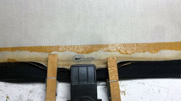 about the middle of the cover 1in wear through spot reinforced with repair cloth