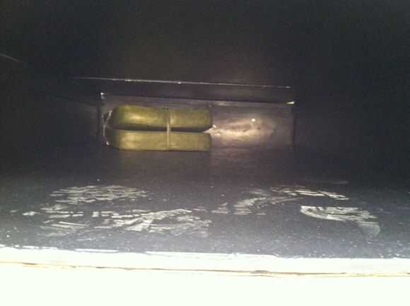 view of storage under the platfrom when raised up.  Put a floor layer down for saving knees when crawling around. Grabbed a little jump seat for a boat or something... Fits well and will make a good place to chill when the platform is down.