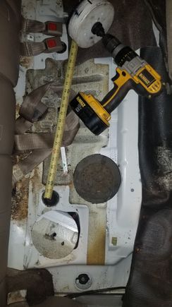 Since everything i do is bymyself crawling around the garage floor i decided i was NOT dropping the gas tank. So i used a 6inch holesaw to get to it instead. Far far eaisier and quicker
 Cureently i sealed the metal edge with a hard set epoxy and then weath stripped a piece of aluminum over it. Pull the carpet back and you would never know it was thier