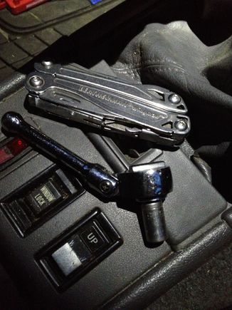 Leatherman Wingman, and 5/16 socket..  pretty simple.