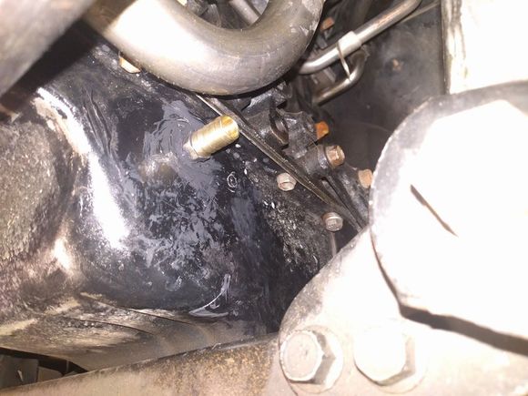 oil drain hose barb installed into pan