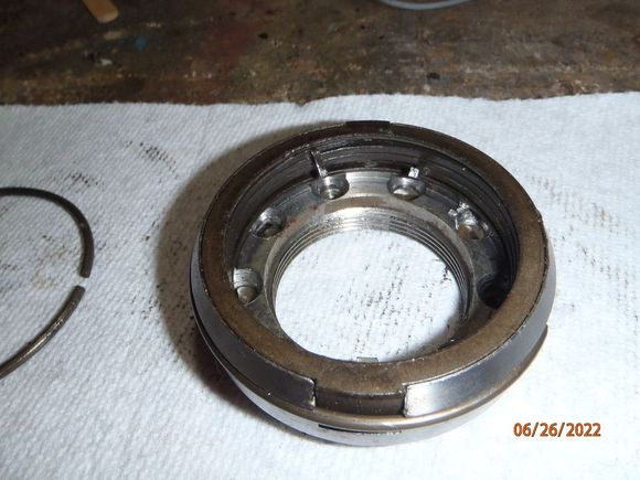 another view with the lock ring/snap ring still installed.  this is the lock plate, brake spring, brake spring cover, and below is the 54mm wheel bearing nut