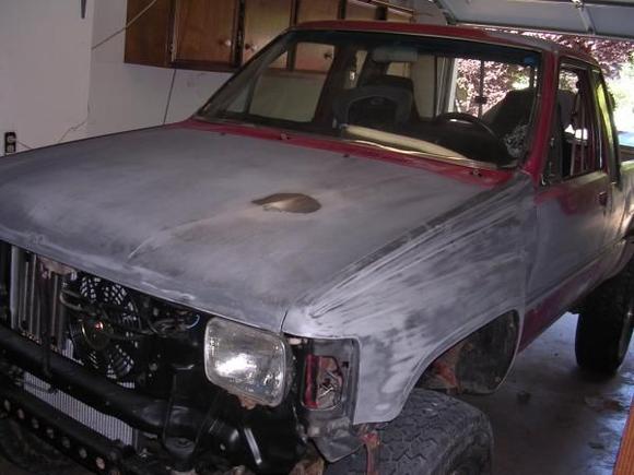 all windows(minus windshield), moulding, and trim removed. sanded and body filler used on dents