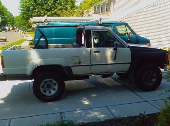 86 4runner with rear fender rust, gas tank rust, new front fenders with faded white paint. 95K miles