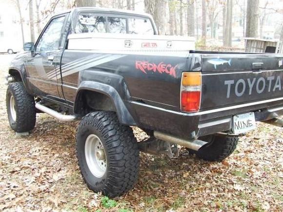 Here is a rear side shot. There is a bit of rust eatin through the rear fender. I sanded it down and sprayed it w/ some Rust-O-Leum. I dunno how to get rid of this rust or how to patch it. Bondo maybe??
