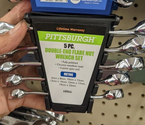 HARBOR FREIGHT FLARE NUT WRENCH SET HAS BOTH 14-MM AND 19-MM WRENCHES. 
Sets from other brands did not have 19-mm.