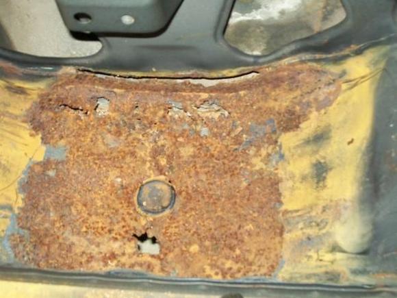 Spare tire well rust.