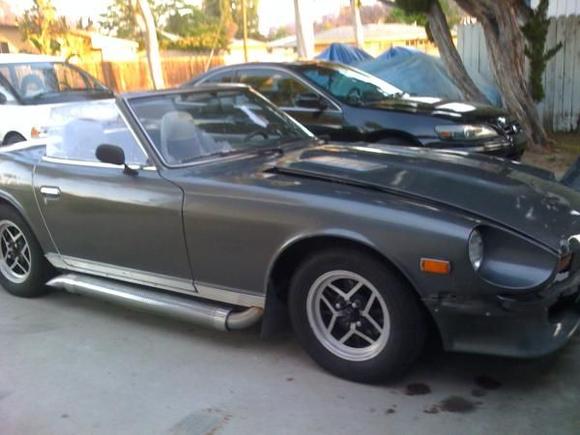 my car sporting new wheels and going with top off